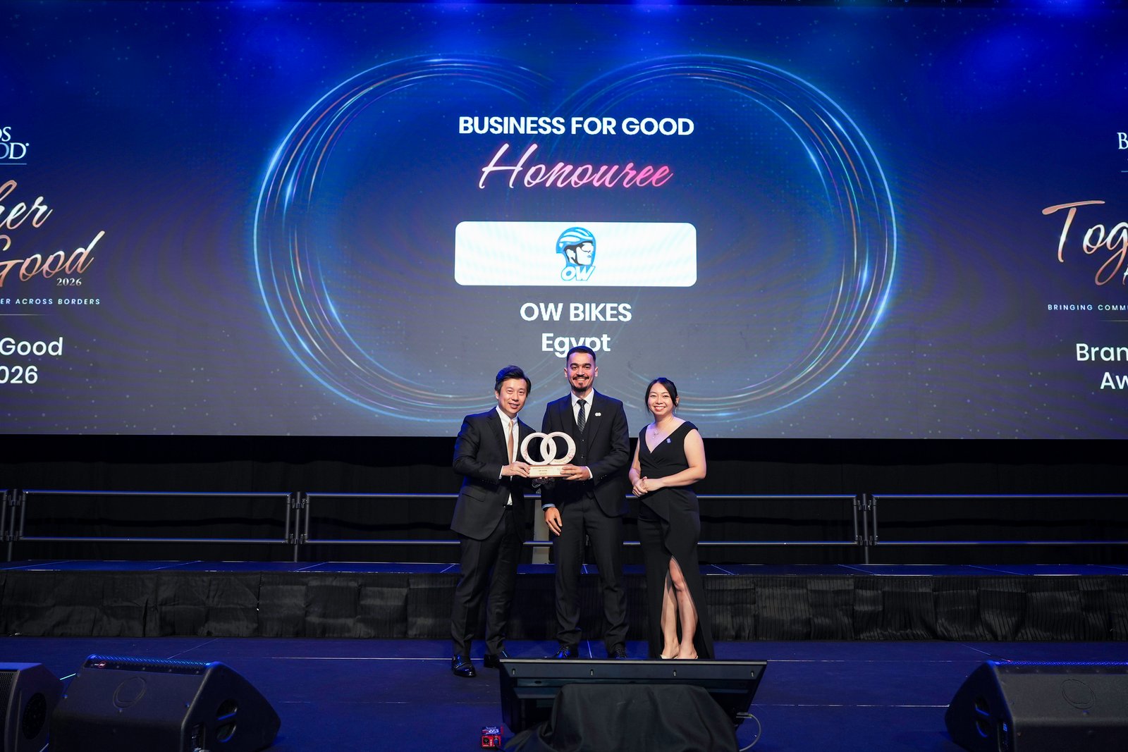 Omar Walid on stage accepting the Business for Good Honouree trophy